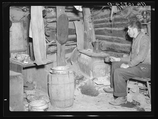 Buckboard Charlie in his shack near Iron River, Michigan