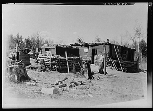 Chicken house and home of Lon Allen, farmer near Iron River, Michigan
