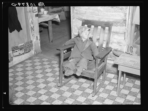 One of Mrs. Bodray's children asleep in their home near Tipler, Wisconsin