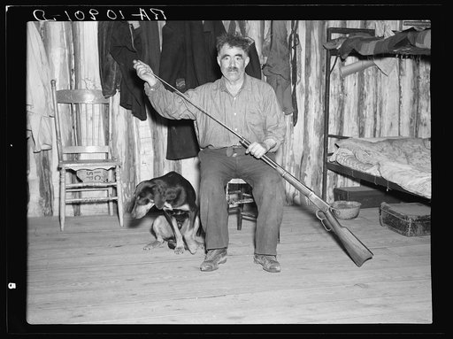 Black Aleck Dickinson and his dog Snoop. Iron County, Michigan
