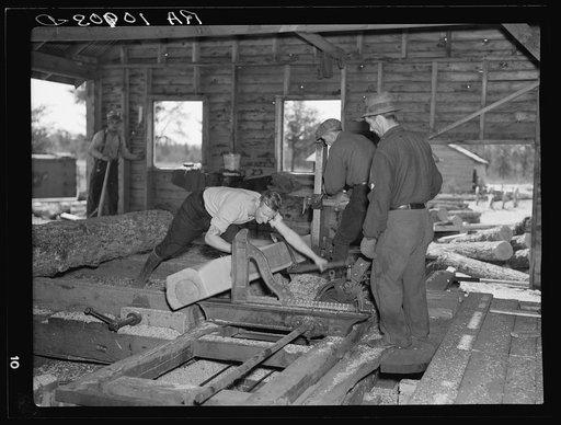 Sawing ties in a sawmill at Gibbs City, Michigan
