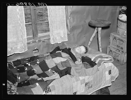 Sick, undernourished baby of Sherman Ritchie, who is a lumberjack when he can find work. Near Iron River, Michigan