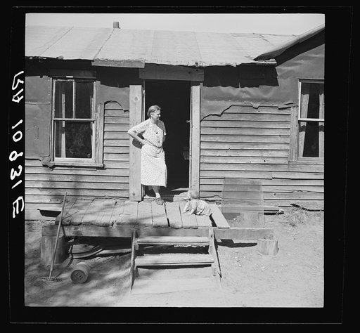 Mother and youngest child of the Govanea family. Gibbs City, Michigan
