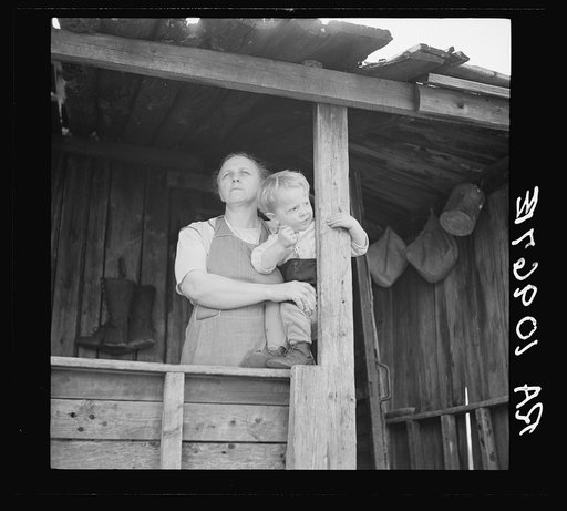 Mrs. William Sharrard and one of her children. Her husband has been a farmer of the cut-over regions for years, but cannot make a living at it. The family is on relief. Near Silk Lake, Michigan