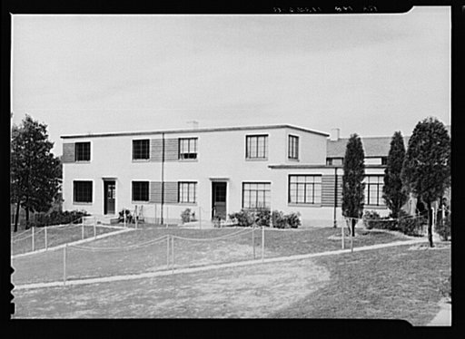 Rear view of completed two-family house. Greenbelt, Maryland