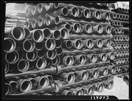 Washington, D.C. Construction of temporary war emergency buildings on the Mall, near 16th and 17th Streets, N.W. Pile of cast iron pipe