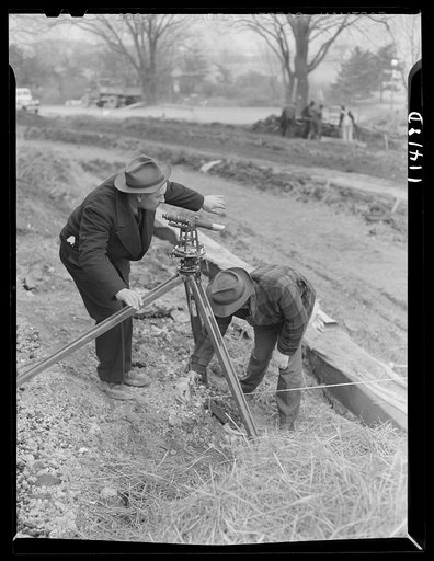 Washington, D.C. Construction of a bridge and road near Independence Avenue and 14th  and 16th Streets, S.W. Engineer sighting a transit