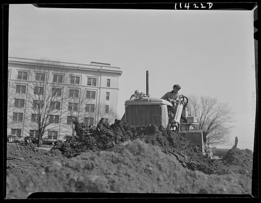 Washington, D.C. Construction of a bridge and road near Independence Avenue and 14th and 16th Streets, S.W. Bulldozer moving dirt