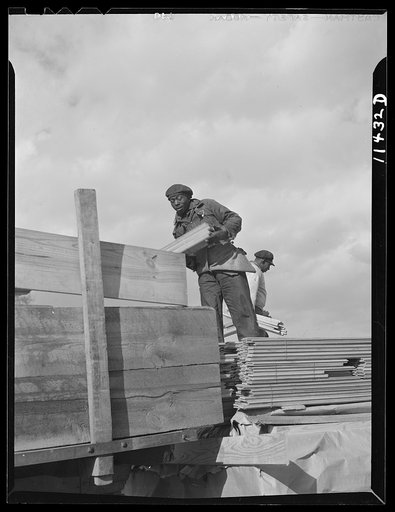 Washington, D.C. Construction of a bridge and road near Independence Avenue and 14th and 16th Streets, S.W. Unloading lumber