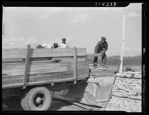 Washington, D.C. Construction of a bridge and road near Independence Avenue and 14th and 16th Streets, S.W. Unloading lumber