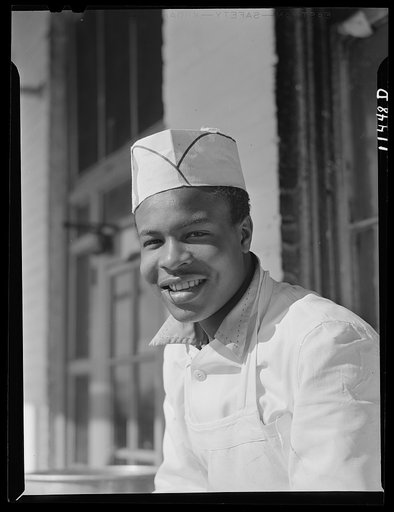 Washington, D.C. Cook who works in one of the seafood restaurants in the fish market district