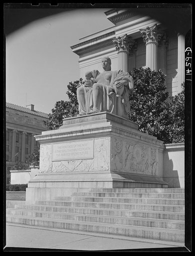Washington, D.C. Statue on the left of the main entrance to the National Archives of the United States bears the inscription, "The heritage of the past is the seed that brings forth the harvest of the future"
