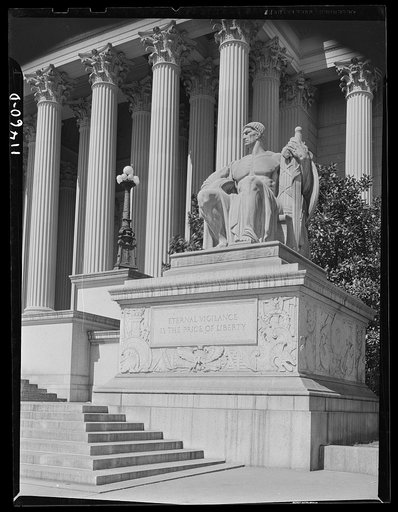 Washington, D.C. Statue on the right of the main entrance to the National Archives of the United States bears the inscription "Eternal vigilance is the price of liberty"