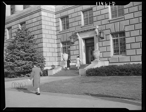 Washington, D.C. Government employees entering the 14th Street and Constitution Avenue entrance of the Department of Commerce building at 9:30 a.m.