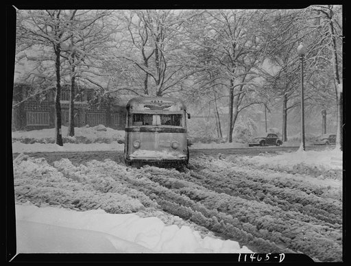 Washington, D.C. Bus going through the snow near Connecticut Avenue and Chevy Chase Circle