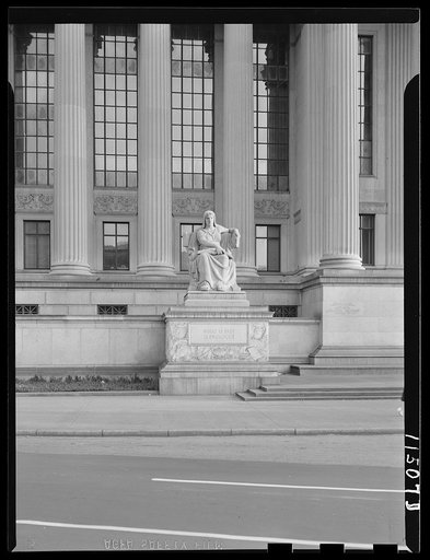Washington, D.C. Statue on the Pennsylania Avenue entrance to the National Archives of the United States. The inscription reads: "What is past is prologue"