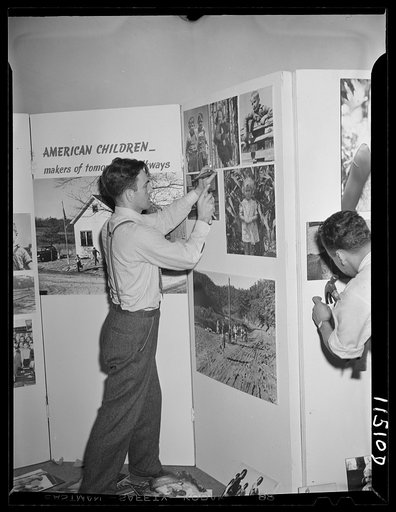 Washington, D.C. Milton Tinsley preparing the Faces of America exhibit at the National Folk Festival in Constitution Hall
