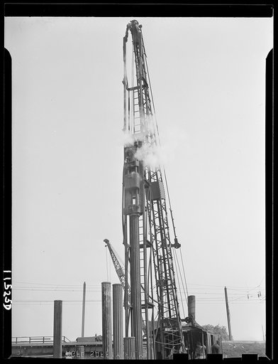 Washington, D.C. Piledriver driving steel piles for a bridge on lower 14th Street, S.W.