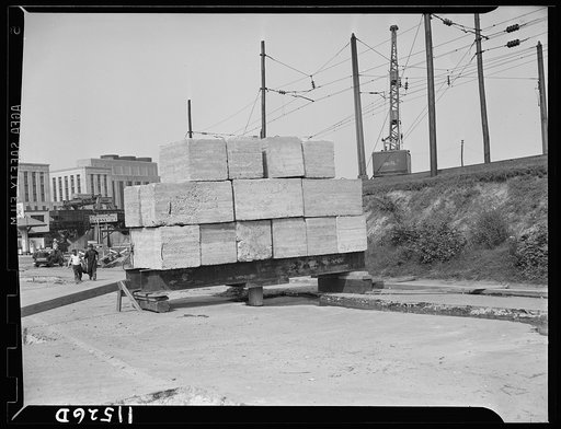 Washington, D.C. Test pile loaded with concrete blocks to determine how much the pile will sink when the bridge structure is finished