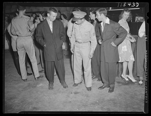 Washington, D.C. Soldier inspecting a couple of "zoot suits" at the Uline Arena during Woody Herman's Orchestra engagement there