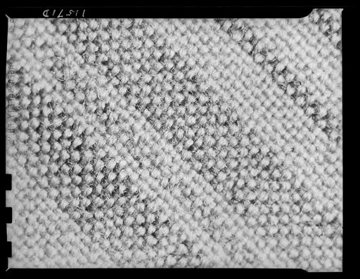 Texture background for motion picture and filmstrip titles. Wool fabric tweed detail