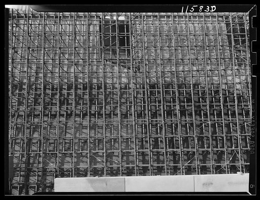 Texture background for motion picture and filmstrip titles. Complex pattern formed by reinforcing rods for concrete construction