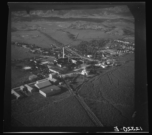 Air view of sugar refinery surrounded by fields. Near Ponce, Puerto Rico