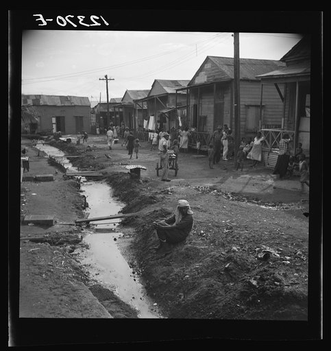 Street and open sewer in the workers' quarter of Porta De Tierra. San Juan Puerto Rico