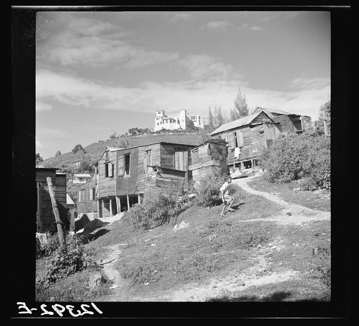 Villa of the owner of a sugar plantation and refinery and sugar workers' shacks. Ponce, Puerto Rico