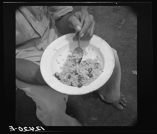 Rice and beans. This is popular food of the island; when there is enough money available, a few pieces of dried codfish are added for flavor. Every single ingredient is imported from the continental United States. Puerto Rico