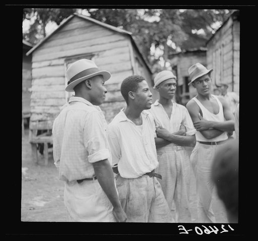 Negro sugar workers in front of their homes near Ponce, Puerto Rico
