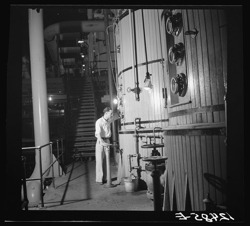 Reading the gauges on the boilers in a sugar refinery near Ponce, Puerto Rico