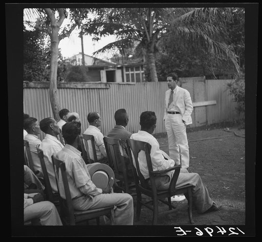 Members of sugar refinery cooperative being addressed by project manager. Central Lafayette, Puerto Rico