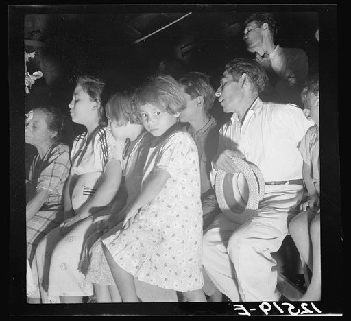 Audience at a "rosario," a semi-religious ceremony used for "cures" among the Hibaros. Near Cidra, Puerto Rico
