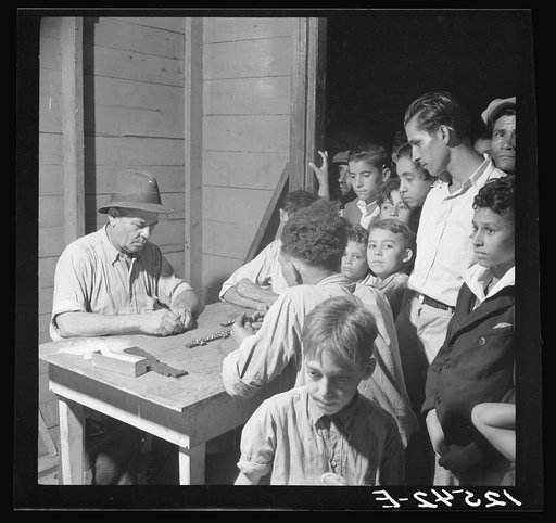 A game of dominos in the workers' quarter of Puerto De Tierra. San Juan, Puerto Rico