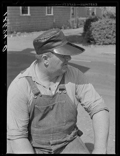 Fisherman wearing characteristic fisherman's hat. Provincetown, Massachusetts
