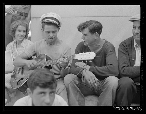 Local talent makes music on a Sunday afternoon under soldiers' monument. Provincetown, Massachusetts