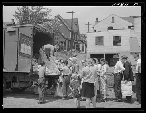 Distribution of surplus commodities near the railroad station. Huntingdon, Pennsylvania