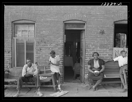 Negro family and their home in one of the alley dwelling sections.  Washington, D.C.