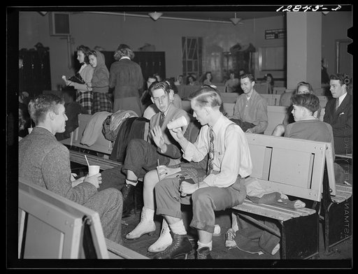 Chevy Chase Ice Palace, Washington. D.C. Skaters sitting down enjoying refreshments