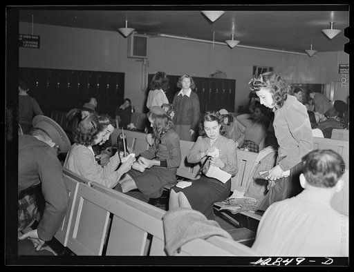 Chevy Chase Ice Palace, Washington. D.C. Girls cleaning and polishing skates before fastening them on