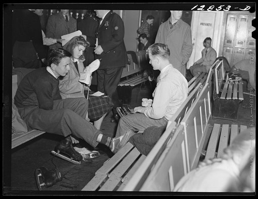 Chevy Chase Ice Palace, Washington. D.C. Skaters fastening skates