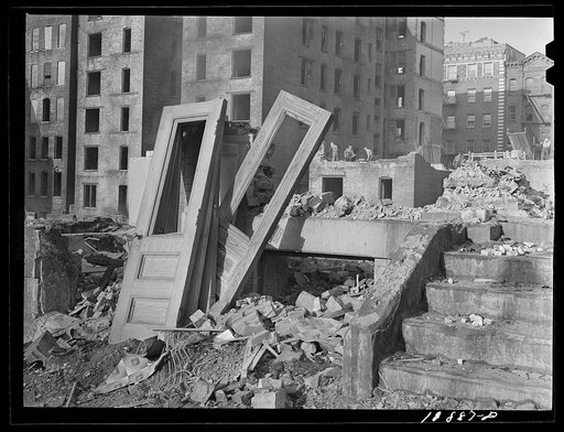 New York, New York. Demolition for slum clearance. Whole blocks of a slum area are torn down to make room for a housing project