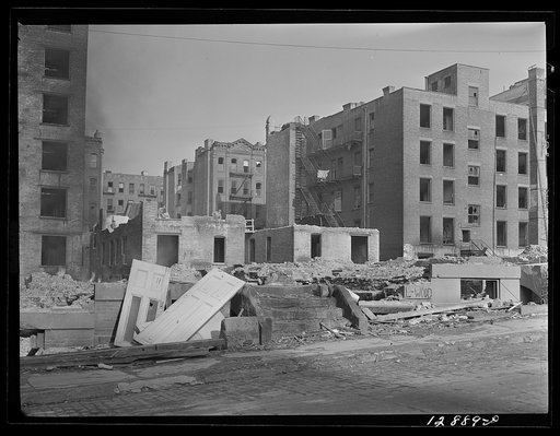 New York, New York. Demolition for slum clearance. Whole blocks of a slum area are torn down to make room for a housing project