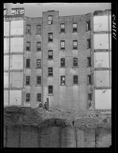Employees of a wrecking company eating lunch. New York, New York