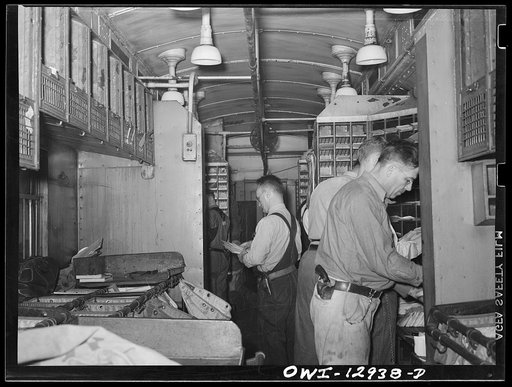 Sorting mail on board a mail car