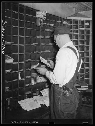 Sorting mail on board a mail car