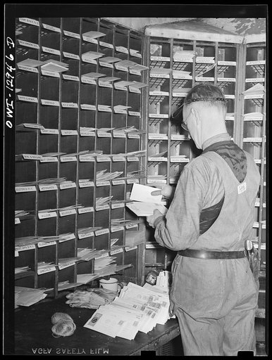 Sorting mail on board a mail car