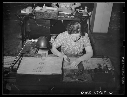 Washington, D.C. Sectioning stamps preparatory to coiling at the United States Bureau of Engraving and Printing