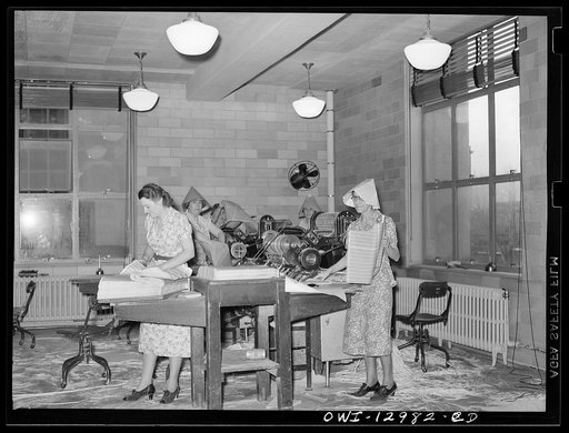 Washington, D.C. Perforating, examining and counting postage stamps at the United States Bureau of Engraving and Printing